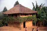africa;african;africans;hut;huts;home;home;house;housing;dwelling;residence;two-storey;two_storey;two-story;two_story;two-tiered;two_tiered;thatch;thatch-roof;thatched;mud;mud-hut;mud_hut;child;children;entrance;door;balcony;bush;tree;trees;poor;poverty;tradition-;tradtitions;traditional;culture;cultures;cultural;third-world;zaire;congo;democratic-republic-of-congo;banana-palm