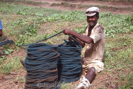 Fisherman;african;fishermen;fishing;ocean;sea;atlantic;elmina;ghana;ghanain;west-africa;rope;ropes;coil-;coils;winding;wind;old;elderly;work;working;injured;traditional;tradition;manual