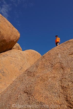 Africa;boy;boys;child;children;climb;climber;climbing;Erongo-Region;geological;geology;Groot-Spitzkop;Namib-Desert;Namibia;orange;person;rock;rock-formation;rock-formations;rock-outcrop;rock-outcrops;rock-tor;rock-torr;rock-torrs;rock-tors;rocks;skies;sky;Southern-Africa;Spitzkop;Spitzkoppe;stone;unusual-natural-feature;unusual-natural-features