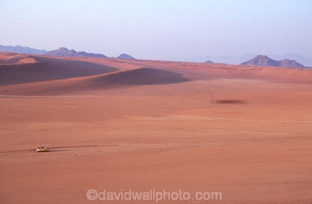 wilderness-camping;safier-farm;namib-desert;namibia;africa;flat;plain;plains;slope;truck;small;miniature;sand-dune;sand-dunes;rock;rocks;sparse;empty;bare