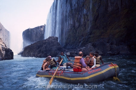 Victoria-Falls;Zambezi;Zambezi-River;Zimbabwe;Zambia;Southern-Africa;Africa;African;raft;dinghy;dingy;boat;inflatable;water;white-water;whitewater;rock;rocks;rocky;cliff;cliffs;waterfall;waterfalls;adventure;tourist;tourism;tourists;guide;tour-guide;tour