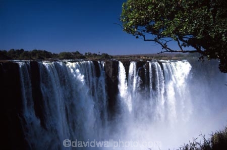 Victoria-Falls;Zambezi-River;Zimbabwe;Zambia;Africa;African;Southern-Africa;waterfall;waterfalls;water;nature;natural;wonder-of-the-world;world-wonder;seven-natural-wonders-of-the-wo;mist;misty;spary;refraction;high;power;powerful;vertical;;flow;chasm;global-warming;gush;cliff;cliffs;bluff;bluffs;crevasse;crevasses;falling;falls;fall;phenomena;phenomenon;precipice;precipices