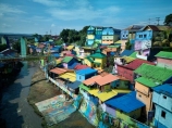 Indonesia;aerial;aerial-photo;aerial-photograph;aerial-photographs;aerial-photography;aerial-photos;aerial-view;aerial-views;aerials;drone-aerial;drone;Malang;Java;East-Java;Indonesia;Brantas-River;Roof;roofs;rooves;Kampung-Warna-Warni;Kampung;Warna-Warni;Kampung-Warna_Warni;Warna_Warni;bridge;bridges;pedestrian-bridge;pedestrian-bridges;tourism;travel;Asia;South-East-Asia;Southeast-Asia