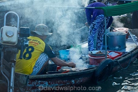 Asia;Asian;barbeque;barbeques;boat;boat-market;boats;Cn-Tho;Cai-Rang;Cai-Rang-floating-market;calm;Can-Tho;Can-Tho-City;Can-Tho-River;cook;cooking;CÃ¡i-Rang;CÃ¡i-Rang-Floating-Market;floating-market;floating-markets;food-boat;food-food-stall;male;man;market;markets;Mekong-Delta;Mekong-Delta-Region;Mekong-River;people;person;smoke;smokey;South-East-Asia;Southeast-Asia;stall;Vietnam;Vietnamese;water-market;wooden-boat;wooden-boats
