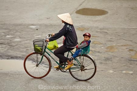 Asia;Asian-conical-hat;Asian-conical-hats;bicycle;bicycles;bike;bikes;child;children;conical-hat;conical-hats;cycle;cycler;cyclers;cycles;cyclist;cyclists;leaf-hat;leaf-hats;Ninh-Binh;Ninh-BÃ¬nh-province;Ninh-Hai;non-la;Northern-Vietnam;nÃ³n-lÃ¡;palm_leaf-conical-hat;people;person;push-bike;push-bikes;push_bike;push_bikes;pushbike;pushbikes;rain;raining;rainy;South-East-Asia;Southeast-Asia;street;street-scene;street-scenes;streets;Van-Lam-Village;Vietnam;Vietnamese;Vietnamese-conical-hat;Vietnamese-conical-hats;Vietnamese-hat;Vietnamese-hats;Vietnamese-symbol;woman;women