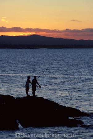 coast;dusk;fish;fisher;fisherman;fishermen;fisherwoman;harbor;harbors;harbour;harbours;relaxing;rod;sunset;water