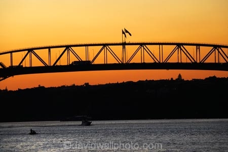 Auckland;Auckland-Harbour-Bridge;bridge;bridges;dusk;evening;flag;flags;N.I.;N.Z.;New-Zealand;NI;nightfall;North-Island;NZ;orange;silhouette;silhouettes;sky;span;spans;steel;structure;structures;sunset;sunsets;transport;transportation;twilight;Waitemata-Harbor;Waitemata-Harbour