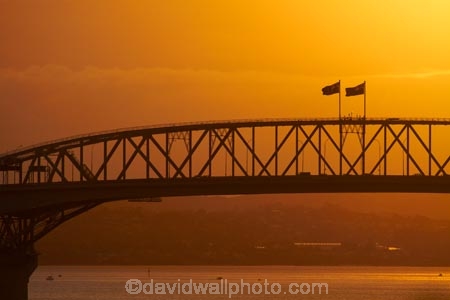 Auckland;Auckland-Harbour-Bridge;bridge;bridges;dusk;evening;flag;flags;infrastructure;N.I.;N.Z.;New-Zealand;NI;nightfall;North-Is.;North-Island;Nth-Is;NZ;orange;road-bridge;road-bridges;silhouette;silhouettes;sky;span;spans;steel;structure;structures;sunset;sunsets;traffic-bridge;traffic-bridges;transport;transportation;twilight;Waitemata-Harbor;Waitemata-Harbour