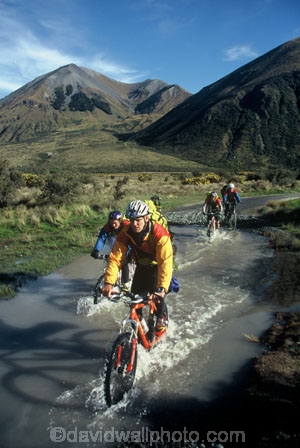 bicycle;bicycles;bike;biker;bikes;biking;cycle;cycling;cyclist;excercise;excercising;healthy;mountain;mountains;multi-sport;multi_sport;multisport;outdoor;outdoors;outside;pedal;pedaling;pedals;puddle;race;racing;recreation;splash;splashing;wheel;wheels