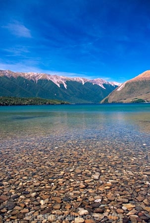 lake;lakes;mountain;mountains;clear-water;clear-sky;blue-sky;beach;beaches;Lake-Rotoiti;Nelson-Lakes-National-Park;nelson-lakes;national-park;national-parks;forest;forests;clear;clean;water;south-island;pure;natural;fresh;stones;stone;stoney;gravel;gravelly;transparent;untouched