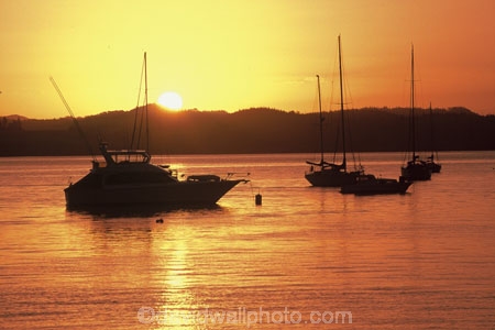 boat;boats;color;colour;dusk;launch;launches;mast;masts;orange;water;yacht