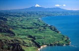 agriculture;cliff;cliffs;coast;coastline;dairy;farm;farmer;farming;farmland;farms;field;fields;grass;green;lush;meadow;meadows;mountain;mountains;ocean;paddock;paddocks;pasture;pastures;rural;sea;shore;shoreline;snow;spring;tasman;verdant;volcano;volcanoes