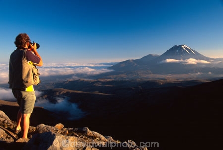 cloud;cone;crater;craters;environment;figure;fog;man;mist;misty;mountain;mystery;nature;peak;peaks;person;photographer;slope;slopes;snow;spectator;sunrise;volcanic;volcano