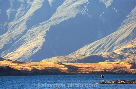 fishing;fisherman;mountain;mountains;proportion;small;tiny;insignificant;minute;huge;big;massive;large;lake;river;choppy;background