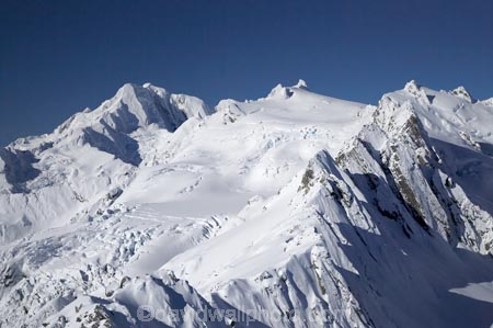 above;aerial;aerial-photo;aerial-photograph;aerial-photographs;aerial-photography;aerial-photos;aerial-view;aerial-views;aerials;alp;alpine;alps;backcountry;Baird-Range;cold;Frans-Josef-Glacier-neve;Frans-Josef-neve;Franz-Josef-Glacier;glacial;glacier;glaciers;high-altitude;highcountry;ice;icy;main-divide;mount;Mount-Elie-de-Beaumont;mountain;mountainous;mountains;mountainside;mt;Mt-Elie-de-Beaumont;mt.;Mt.-Elie-de-Beaumont;N.Z.;neve;New-Zealand;NZ;outdoors;range;ranges;S.I.;SI;snow;snowy;South-Is.;South-Island;South-West-New-Zealand-World-Heritage-Area;southern-alps;Spa-Glacier;Te-Poutini-National-Park;Te-Wahipounamu;West-Coast;Westland;westland-national-park;White;winter;World-Heritage-Area
