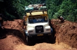 overland-truck;truck;vehicle;travel;travelling;transport;transportation;diesel;diesel-truck;carry;passenger;passengers;track;tracks;road;roads;dirt-road;dirt-track;front;dip;ditch;pothole;route;zaire;congo;democratic-republic-of-congo