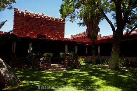 1908;1909;Africa;building;buildings;castle;castles;courtyard;courtyards;Duweseb-Castle;Duwiseb-Castle;Duwisib-Castle;grass;green;heritage;historic;historic-building;historic-buildings;historical;historical-building;historical-buildings;history;lush;Maltahohe;MaltahÃ¶he;Namib-Desert;Namibia;old;Schloss-Duwisib;shade;shady;Southern-Africa;stone-architecture;stone-building;stone-builidings;tradition;traditional;tree;trees;yard