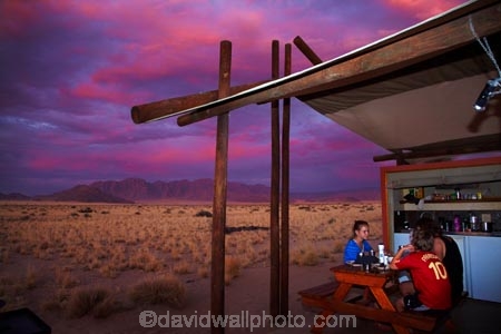 accommodation;Africa;children;cloud;clouds;color;colorful;colour;colourful;Desert-Camp;dusk;evening;families;family;family-holiday;family-holidays;holiday;holiday-accommodation;holidays;hotel;hotels;lodge;lodges;luxury-tent;luxury-tents;mountain;mountains;Namib-Desert;Namibia;night;night_time;nightfall;people;permanent-tent;permanent-tents;person;pink;range;ranges;red;resort;resorts;Sesriem;skies;sky;Southern-Africa;sunset;sunsets;tent;tents;twilight;vacation;vacations