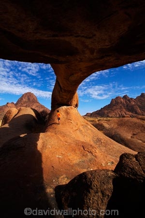 Africa;archway;archways;bald-granite-peak;bald-granite-peaks;bornhardts;boy;boys;child;children;Erongo-Region;families;family;family-holiday;family-holidays;geological;geology;Groot-Spitzkop;holiday;holidays;inselberg;inselbergs;monadnock;monadnocks;Namib-Desert;Namibia;Natural-Arch;Natural-Arches;natural-bridge;natural-bridges;natural-geological-formation;natural-geological-formations;Natural-Rock-Arch;natural-rock-arches;natural-rock-archs;natural-rock-bridge;natural-rock-bridges;people;person;Pondok;Pondok-Mountain;Pondok-Mountains;Pondoks;rock;rock-arch;rock-arches;rock-formation;rock-formations;rock-outcrop;rock-outcrops;rock-tor;rock-torr;rock-torrs;rock-tors;rocks;Southern-Africa;Spitzkop;Spitzkoppe;stone;tourism;tourist;tourists;unusual-natural-feature;unusual-natural-features;unusual-natural-formation;unusual-natural-formations;wilderness;wilderness-area;wilderness-areas