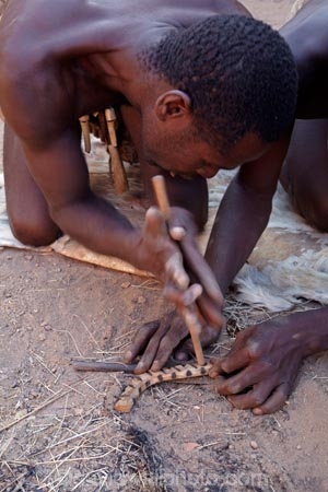 Africa;African;African-people;cultural;cultural-exchange;culture;Damara-culture;Damara-Living-Museum;Damara-Living-Village;Damara-Village;Damaraland;Damaraland-Living-Museum;demonstration;demonstrations;fire;fire-craft;fire-lighting;fire-lighting-with-sticks;Fire-making;fire-starting;fire-starting-with-sticks;fires;flame;flames;Kunene-District;Kunene-Region;Living-Museum;Living-Museums;making-fire;making-fires;Namib-Desert;Namibia;people;person;rubbing-sticks-together;Southern-Africa;tradition;traditional;traditional-clothing;traditional-costume;traditional-dress;Twyfelfontein
