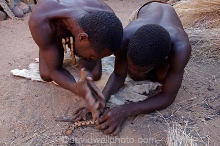 Africa;African;African-people;cultural;cultural-exchange;culture;Damara-culture;Damara-Living-Museum;Damara-Living-Village;Damara-Village;Damaraland;Damaraland-Living-Museum;demonstration;demonstrations;fire;fire-craft;fire-lighting;fire-lighting-with-sticks;Fire-making;fire-starting;fire-starting-with-sticks;fires;flame;flames;Kunene-District;Kunene-Region;Living-Museum;Living-Museums;making-fire;making-fires;Namib-Desert;Namibia;people;person;rubbing-sticks-together;Southern-Africa;tradition;traditional;traditional-clothing;traditional-costume;traditional-dress;Twyfelfontein