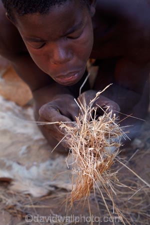 Africa;African;African-people;cultural;cultural-exchange;culture;Damara-culture;Damara-Living-Museum;Damara-Living-Village;Damara-Village;Damaraland;Damaraland-Living-Museum;demonstration;demonstrations;fire;fire-craft;fire-lighting;fire-lighting-with-sticks;Fire-making;fire-starting;fire-starting-with-sticks;fires;flame;flames;Kunene-District;Kunene-Region;Living-Museum;Living-Museums;making-fire;making-fires;Namib-Desert;Namibia;people;person;rubbing-sticks-together;Southern-Africa;tradition;traditional;traditional-clothing;traditional-costume;traditional-dress;Twyfelfontein