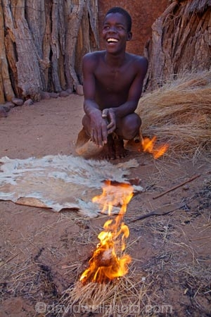 Africa;African;African-people;cultural;cultural-exchange;culture;Damara-culture;Damara-Living-Museum;Damara-Living-Village;Damara-Village;Damaraland;Damaraland-Living-Museum;demonstration;demonstrations;fire;fire-craft;fire-lighting;fire-lighting-with-sticks;Fire-making;fire-starting;fire-starting-with-sticks;fires;flame;flames;Kunene-District;Kunene-Region;Living-Museum;Living-Museums;making-fire;making-fires;Namib-Desert;Namibia;people;person;rubbing-sticks-together;Southern-Africa;tradition;traditional;traditional-clothing;traditional-costume;traditional-dress;Twyfelfontein