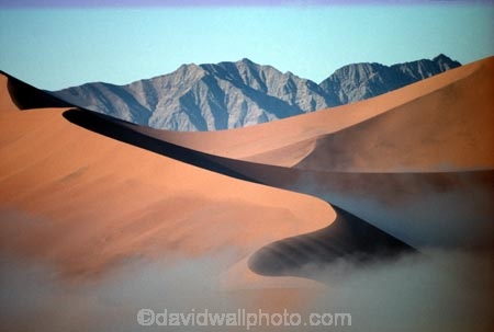 Sossusvlei;Namib_Naukluft-National-Park;national-park;Namibia;Southern-Africa;Africa;African;arid;aridity;barren;barreness;desert;deserts;deserted;empty;wilderness;solitude;sand-dune;sand-dunes;dune;dunes;sand_dune;sand_dunes;natural;nature;hot;dry;dried;remote;landscape;landscapes;desolate;desolation;ecosystem;ecosystems;loneliness;orange;red;namib;curve;curves;line;lines;misty;ripple;ripples;sand;cloud;mist;fog;low-cloud;slope;slopes;angle;sparse