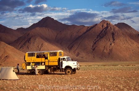 wilderness-camping;Namib-Desert;Namibia;Southern-Africa;Africa;African;plain;plains;landscape;sparse;empty;desert;deserted;africa;african;wilderness;vast;barren;desolate;desolation;dried;dry;land;ground;outdoor;outdoors;outside;surface;surfaces;camp;camping;camper;campers;truck;trucks;tent;tents;4wd;four-wheel-drive;4-x-4;4x4;suv;ruv;mountain;mountains;sand;sandy;adventure;tourism;holiday;holidays;vacation;vacation;safari;safaris