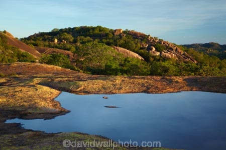 Africa;Big-Cave-Camp;boulder;boulders;Bulawayo;calm;geological;geology;granite;kopje;kopjes;koppie;koppies;Matobo-Hills;Matobo-National-Park;Matopos-Hills;placid;pond;ponds;pool;pools;quiet;reflected;reflection;reflections;rock;rock-formation;rock-formations;rock-outcrop;rock-outcrops;rock-tor;rock-torr;rock-torrs;rock-tors;rocks;serene;smooth;Southern-Africa;still;stone;tranquil;unusual-natural-feature;unusual-natural-features;water;Zimbabwe