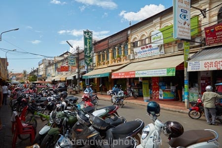 Asia;bike;bikes;boutique;boutiques;building;buildings;Cambodia;commerce;commercial;Indochina-Peninsula;Kampuchea;Kingdom-of-Cambodia;motorbike;motorbikes;motorcycle;motorcycles;people;person;retail;retail-store;retailer;retailers;scooter;scooters;shop;shopper;shoppers;shopping;shops;Siem-Reap;Siem-Reap-Province;Southeast-Asia;step_through;step_throughs;store;stores;street;street-scene;street-scenes;streets;tourism;tourist;tourists;veranda;verandah;verandahs