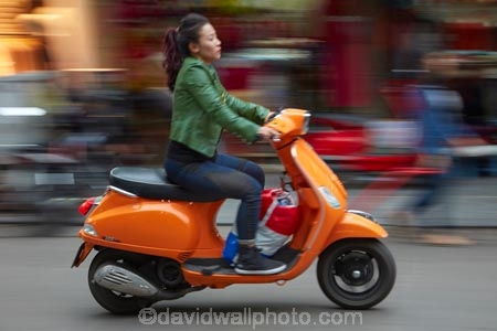 Asia;Asian;bike;bikes;blur;blurred;blurry;female;Hanoi;Hanoi-Old-Quarter;motion-blur;motorbike;motorbikes;motorcycle;motorcycles;motorscooter;motorscooters;Old-Quarter;orange;people;person;scooter;scooters;South-East-Asia;Southeast-Asia;speed-blur;step_through;step_throughs;street;street-scene;street-scenes;streets;vespa;vespas;Vietnam;Vietnamese;woman;women