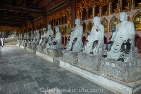 alabaster;Arhat;Arhats;Asia;Bai-Dinh-Buddist-Temple;Bai-Dinh-Mountain;Bai-Dinh-Temple;Bai-Dinh-Temple-Spiritual-and-Cultural-Complex;Buddhist-Temple;Buddhist-Temples;Buddism;Buddist;Chua-Bai-Dinh;cloister;cloisters;corridor;corridors;Gai-Vien-District;gold;hall;halls;man;marble;men;Ninh-Binh;Ninh-Binh-Province;Ninh-BÃ¬nh-province;Northern-Vietnam;people;person;place-of-worship;places-of-worship;pray;prayer;praying;religion;religions;religious;South-East-Asia;Southeast-Asia;statue;statues;stone;stone-statues;temple;temples;Vietnam;Vietnamese