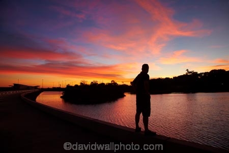 Australasian;Australia;Australian;breakwater;breakwaters;Darwin;Darwin-Harbor;Darwin-Harbour;Darwin-Waterfront;Darwin-Waterfront-Precinct;dusk;evening;groyne;groynes;mole;moles;N.T.;nightfall;Northern-Territory;NT;orange;people;person;Port-Darwin;recreation-lagoon;sea-wall;sea-walls;seawall;seawalls;silhouette;sky;Stokes-Hill-Wharf;sunset;sunsets;Top-End;twilight