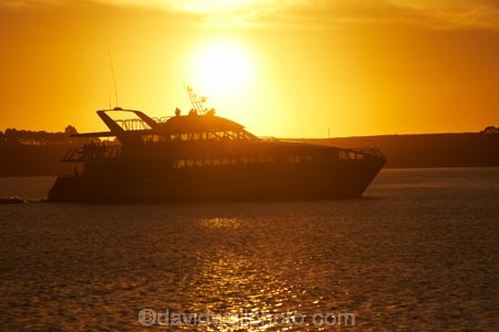 Australasian;Australia;Australian;boat;boats;cruise;cruises;dusk;evening;Gordon-River-Cruise-Boat;Gordon-River-Cruises;Island-of-Tasmania;launch;launches;Macquarie-Harbor;Macquarie-Harbour;nightfall;orange;pleasure-boat;pleasure-boats;sky;State-of-Tasmania;Strahan;Strahan-Harbor;Strahan-Harbour;sunset;sunsets;Tas;Tasmania;The-West;tour-boat;tour-boats;tourism;tourist;tourist-boat;tourist-boats;twilight;water;West-Tasmania;Western-Tasmania
