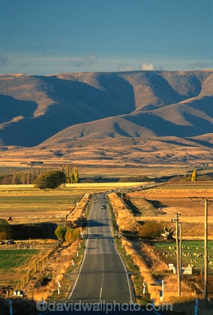 road;highway;highways;roads;seal;sealed;tarsealed;tarseal;straight;meadows;paddocks;fields;farming;rural;landscape;ranges;hills;mountains;journey;route