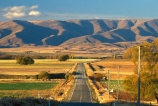 road;highway;highways;roads;seal;sealed;tarsealed;tarseal;straight;meadows;paddocks;fields;farming;rural;landscape;ranges;hills;mountains;journey;route