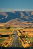 road;highway;highways;roads;seal;sealed;tarsealed;tarseal;straight;meadows;paddocks;fields;farming;rural;landscape;ranges;hills;mountains;journey;route