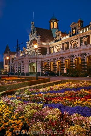 1906;architectural;architecture;bloom;blooming;blooms;building;buildings;dark;Dunedin;Dunedin-Railway-Station;dusk;evening;Flemish-Renaissance-style;flood-light;flood-lights;flood-lit;floodlit;floral;flower;flower-bed;flower-beds;flower-garden;flower-gardens;flowers;garden;gardens;George-A-Troup;Gingerbread-George;heritage;historic;historic-building;historic-buildings;Historic-Railway-Station;historical;historical-building;historical-buildings;history;light;lighting;lights;N.Z.;New-Zealand;night;night-time;night_time;nightfall;nighttime;NZ;old;Otago;public-flower-garden;public-garden;public-gardens;rail;rail-station;rail-stations;railroad;railroads;rails;railway;railway-station;railway-stations;railways;S.I.;SI;South-Is;South-Is.;South-Island;Sth-Is;tail-lights;tradition;traditional;train-station;train-stations;transport;transportation;twilight