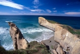 cliff;cliffs;dunedin;tunnel-beach;bluff;bluffs;precipice;person;;high;sea-ocean;pacific;coastline;coast;rock;beaches;wave;waves