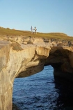 arch;arches;bluff;bluffs;cliff;cliffs;coast;coastal;coastline;coastlines;coasts;couple;Dunedin;formation;geological;geology;N.Z.;Natural-Arch;Natural-Arches;New-Zealand;NZ;Ocean;Oceans;Otago;Pacific-Ocean;people;person;rock;rock-formation;rock-formations;S.I.;sea;shore;shoreline;shorelines;shores;SI;South-Island;steep;stone;Tunnel-Beach