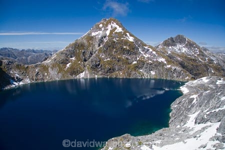 aerial;aerial-photo;aerial-photography;aerial-photos;aerial-view;aerial-views;aerials;air-to-air;alp;alpine;alps;altitude;bluff;bluffs;calm;cliff;cliffs;Fiordland;Fiordland-N.P;Fiordland-National-Park;Fiordland-NP;high;high-altitude;Kepler-Mountains;lake;lakes;mount;Mount-Kidd;mountain;mountain-lake;mountain-lakes;mountainous;mountains;mountainside;mountainsides;mt;Mt-Kidd;mt.;Mt.-Kidd;N.Z.;national-park;national-parks;New-Zealand;NZ;peak;peaks;placid;quiet;range;ranges;reflection;reflections;S.I.;serene;SI;Small-Lake;smooth;snow;snow-capped;snow_capped;snowcapped;snowy;South-Island;south-west-new-zealand-world-heritage-area;Southland;steep;still;summit;summits;tarn;tarns;te-wahi-pounamu;te-wahipounamu;te-wahipounamu-south_west-new-zealand-world-heritage-area;tranquil;water;world-heirtage-site;world-heirtage-sites;world-heritage-area;world-heritage-areas