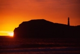 light-house;lighthouses;light-houses;lighthouse;coast;coastline;coastal;shoreline;shore;beach;beaches;headland;promontory;color;colour;colors;colours;orange;dawn;sunrise;Castle-Point-Lighthouse;Wairarapa;North-Island;Pacific;ocean