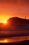 light-house;lighthouses;light-houses;lighthouse;coast;coastline;coastal;shoreline;shore;beach;beaches;headland;promontory;color;colour;colors;colours;orange;dawn;sunrise;Castle-Point-Lighthouse;Wairarapa;North-Island;Pacific;ocean