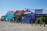 blue;building;buildings;colorful;colourful;corrugated-iron;corrugated-steel;Mapua;Mapua-Wharf;N.Z.;Nelson-Region;New-Zealand;NZ;S.I.;SI;South-Is.;South-Island;Tasman-Bay;The-Mutton-Bird-Cafe;The-Muttonbird-Cafe;The-Original-Smokehouse;The-Smoke-House;The-Smoke_House;The-Smokehouse