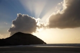beach;beaches;coast;coastal;coastline;dusk;evening;finger-of-god;N.Z.;Nelson-Region;New-Zealand;nightfall;North-West-Nelson-Region;NZ;Pilch-Point;ray-of-light;S.I.;sand;sandy;shore;shoreline;SI;sky;South-Is.;South-Island;sunset;sunsets;Tasman-Sea;twilight;Wharariki-Beach