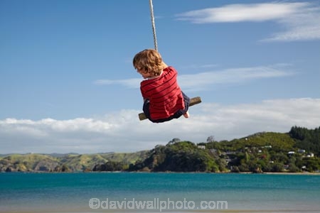 8-year-old;8-years-old;9-year-old;9-years-old;boy;boys;child;children;coast;coastal;coastline;coastlines;coasts;eight-years-old;eigth-year-old;foreshore;fun;happy;joy;kid;kids;kiwi-icon;kiwi-icons;kiwiana;little-boy;little-boys;N.I.;N.Z.;New-Zealand;NI;nine-year-old;nine-years-old;North-Is;North-Is.;North-Island;Northland;NZ;Oakura;Oakura-Bay;outdoor;outside;people;person;play;playing;rope-swing;rope-swings;shore;shoreline;shorelines;shores;sky;summer;summertime;swing;swinging;swings;tidal;tide;water;Whangaruru-Bay;young-boy;young-boys