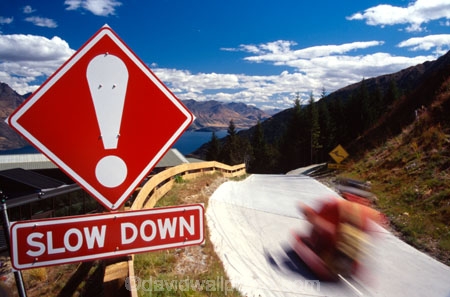 adventure;adventure-tourism;recreation;outdoors;outdoor;outside;holiday;holidays;vacation;vacations;queenstown;south-island;new-zealand;luge;luges;trolley;trolleys;fast;quick;speed;slow;skyline;slow-down;sign;track;curve;curves;turn;turns