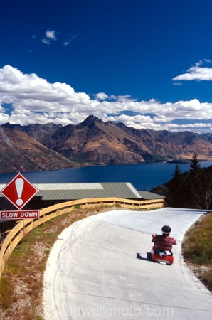 adventure;adventure-tourism;recreation;outdoors;outdoor;outside;holiday;holidays;vacation;vacations;queenstown;south-island;new-zealand;luge;luges;trolley;trolleys;fast;quick;speed;slow;skyline;slow-down;sign;track;curve;curves;turn;turns
