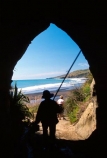 cave;bay-beach;sand;caves;coast;sea-cave;erosion;tourism;tourist;tourists;water;cattle;history;stock-movement;past;agriculture;silhouette.-fisherman;fishing;elderly;retired;holiday